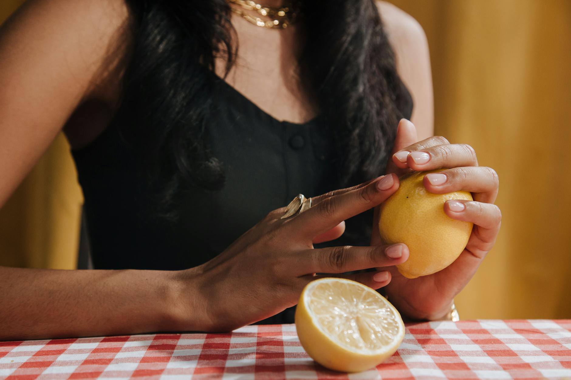 Two hands holding pink and blue silicone vibrators against a pastel background in a gentle, supportive manner.
